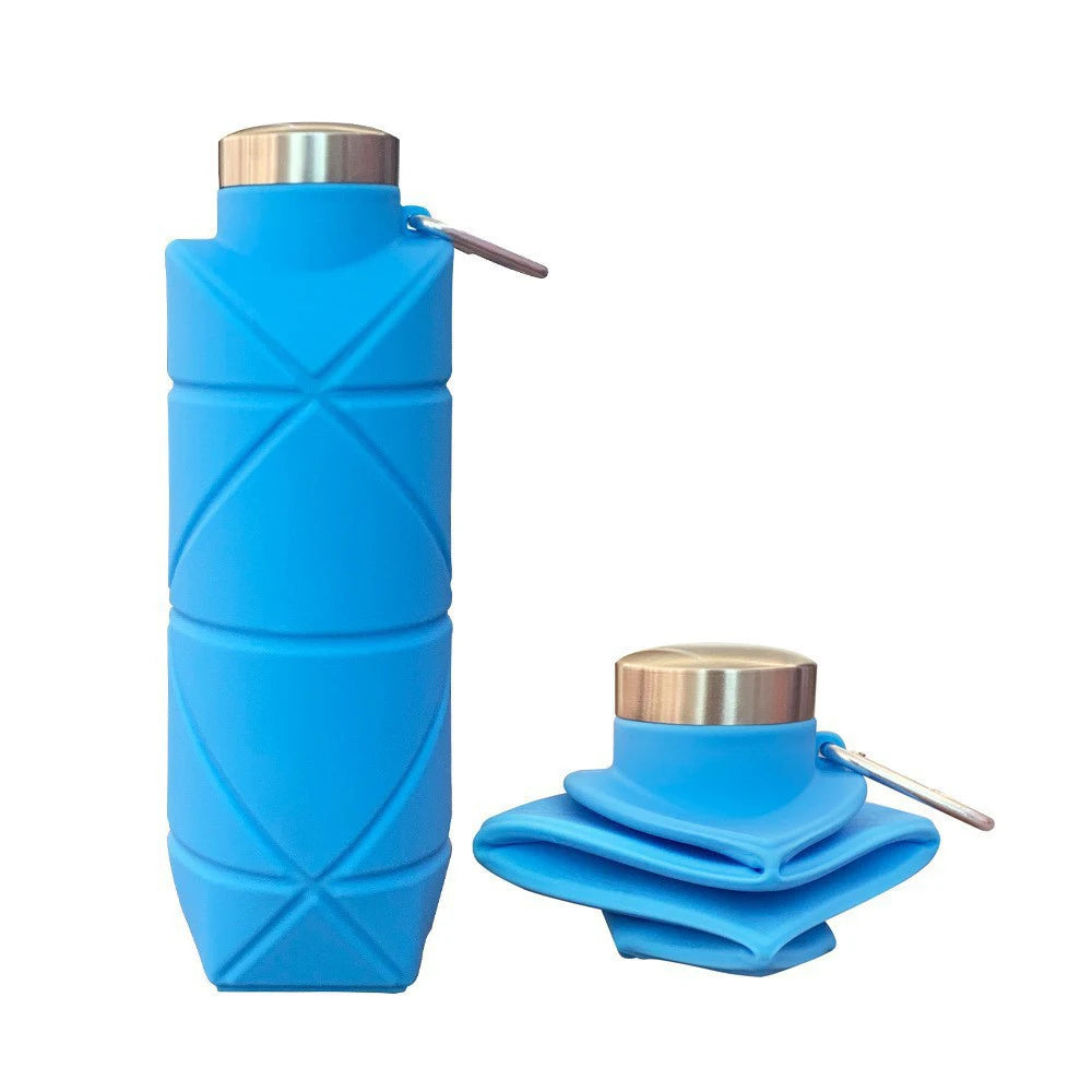 Collapsible silicone water bottle folded flat next to an expanded bottle for travel