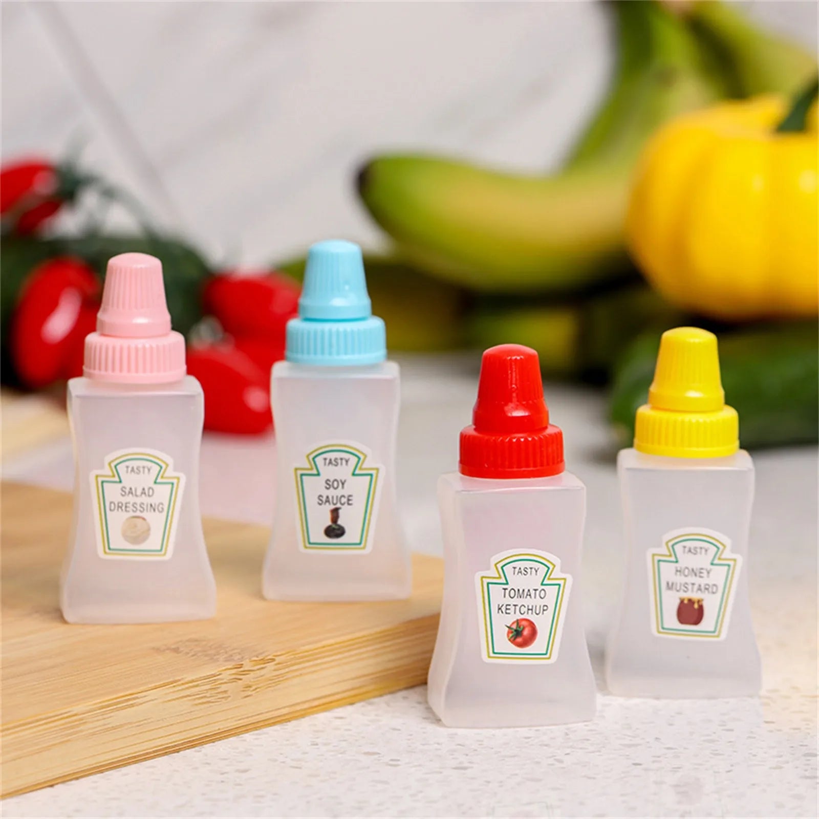 Set of mini refillable condiment bottles for travel, camping, and lunchboxes
