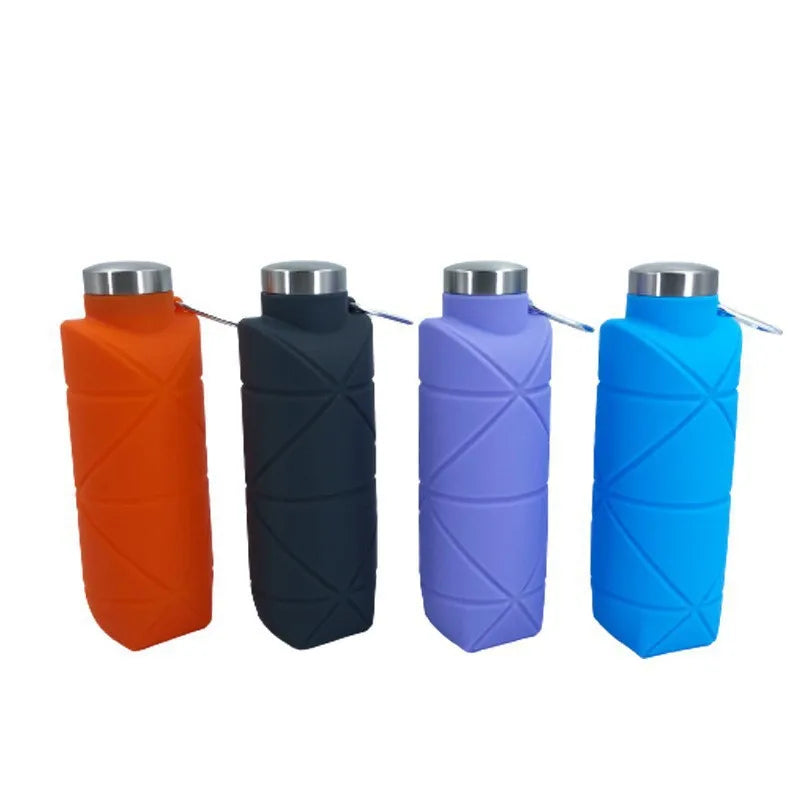Collapsible silicone water bottle folded flat next to an expanded bottle for travel