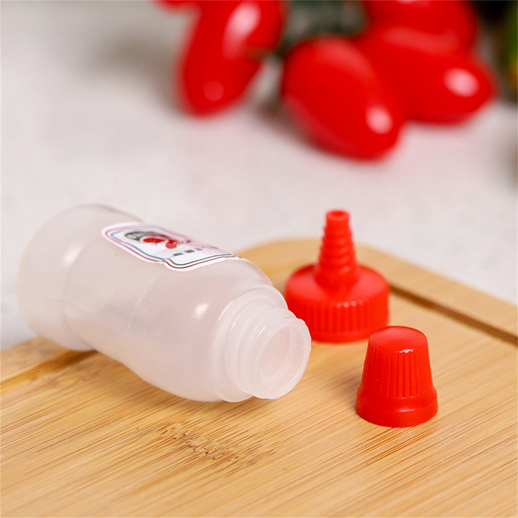 Set of mini refillable condiment bottles for travel, camping, and lunchboxes