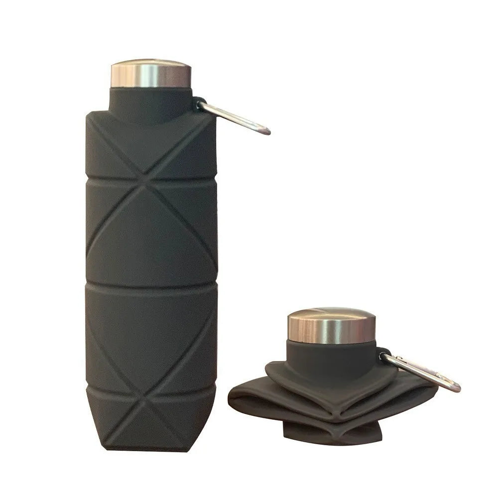 Collapsible silicone water bottle folded flat next to an expanded bottle for travel